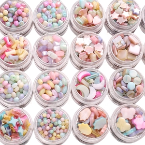 DIY shell bead set with 16 storage jars featuring star, heart and flower shaped charms