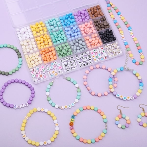 DIY jewelry making kit with macaron beads and letter charms in a 24-grid organizer box