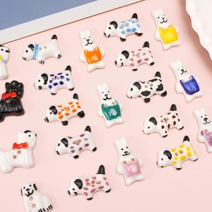 Detailed view of colorful dog and rabbit ceramic buttons for DIY handmade jewelry crafting