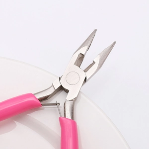 Close-up of pink handle needle nose pliers with stainless steel tips for jewelry DIY
