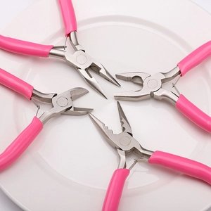 Detailed set of four pink precision jewelry pliers for DIY handmade crafts on white background
