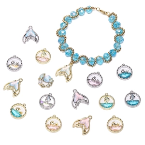 Macro detail of whale tail and starfish charms with alloy frames for DIY jewelry making