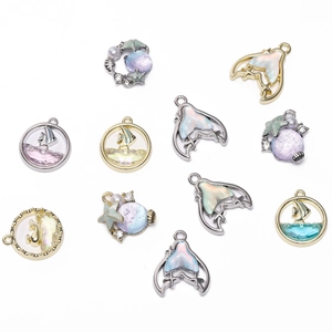 Detail showing mixed ocean theme charms like whale tails and starfish for DIY jewelry