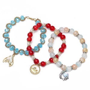 Three-piece ocean themed beaded bracelet set with whale tail and crown alloy charms