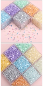 Macro shot of colorful faceted glass beads in storage boxes for DIY jewelry making