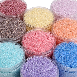 Colorful 4mm glass seed beads in transparent jars for DIY handmade jewelry crafts
