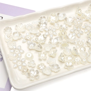 Lustrous white ABS pearl flower beads and floral spacers for DIY jewelry making