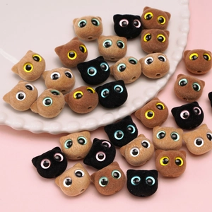 Detailed close-up of colorful flocked resin cat head beads for DIY jewelry making