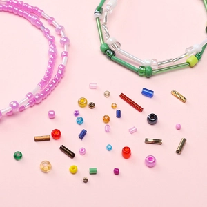 DIY jewelry kit detail showing various colorful seed beads and handmade necklaces
