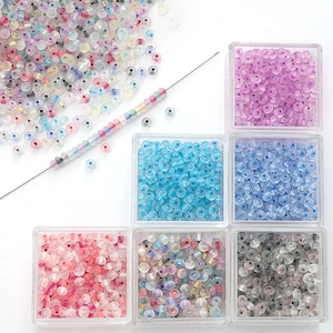 Macro view of crystal glass abacus beads in storage boxes for DIY jewelry making
