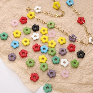 Detail view of multi-color retro 16mm glass flower beads and DIY golden chain necklace
