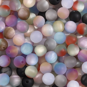 Macro shot of 8mm matte resin cat-eye beads in mixed gradient macaron colors for DIY jewelry