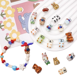 Detailed view of hand-painted ceramic animal beads for DIY bracelets and charms
