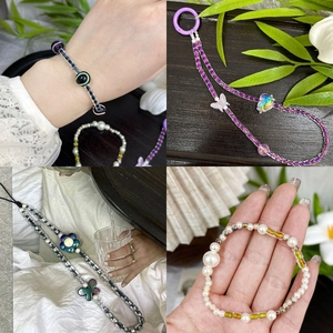 Macro shot of 4x5mm ink retro cylinder beads and handmade beaded charms on bracelets