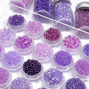 Set di perline di vetro viola in contenitori per gioielli e accessori fai da te