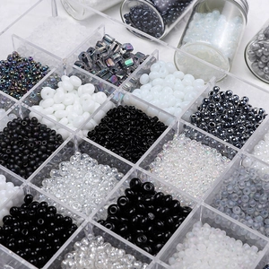Monochrome glass seed beads set in acrylic organizer for DIY jewelry making