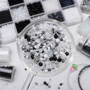 DIY jewelry kit with black and white glass beads for handmade bracelets and necklaces