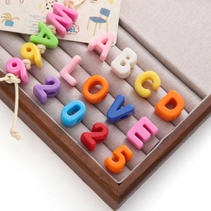 Colorful acrylic alphabet and number beads in a premium jewelry display tray for DIY crafts