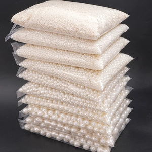 White ABS faux pearl beads set in various sizes packed in transparent bags for DIY jewelry