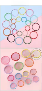 Detail showing colorful macaron binder rings with opening mechanism for DIY binding