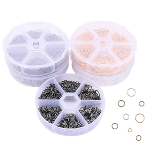 DIY jewelry making kit with various sizes of metal open jump rings in a 6-grid storage box