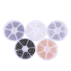 Five boxes of multi-color metal jump rings for DIY jewelry making in clear plastic cases