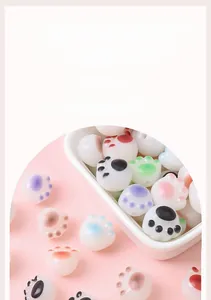 Close-up of colorful acrylic cat paw beads in various pastel colors for DIY jewelry making