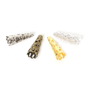 Detailed macro view of hollow cone-shaped metal filigree flower bead caps in four plating colors