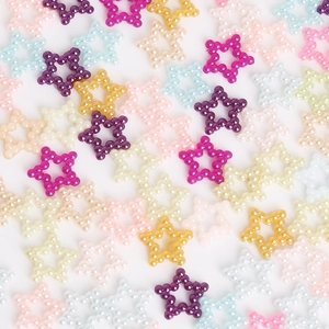 Detailed view of colorful hollow star-shaped ABS pearl beads for DIY craft projects