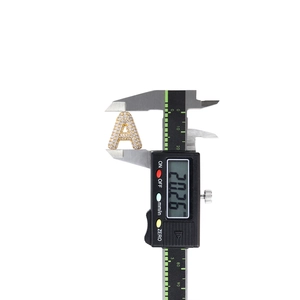 Measurement of 925 sterling silver letter A pendant height using a digital caliper