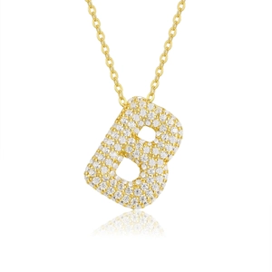Detailed view of an 18K gold letter B pendant necklace with pavé moissanite stones