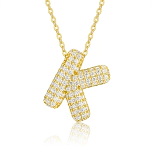 Close-up of golden letter K pendant with sparkling pavé stones on a fine O-chain necklace