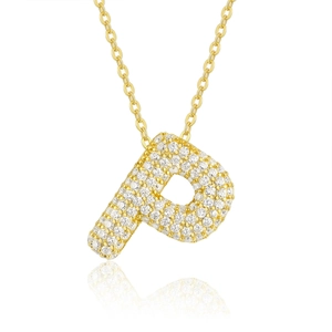 Macro shot of gold-plated letter P pendant set with sparkling moissanite stones