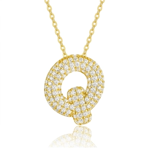 Macro shot of 925 silver letter Q pendant with gold plating and pavé moissanite stones