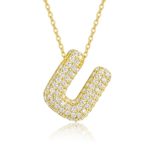 Detailed macro view of 18K gold plated letter U pendant with shimmering moissanite stones