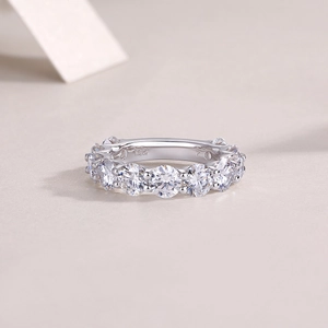 Macro shot of S925 sterling silver eternity band with moissanite stones and S925 stamp