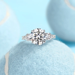 Macro shot of three-stone S925 sterling silver moissanite ring with pave diamond details