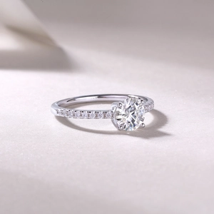 Close-up of S925 sterling silver ring with classic four-prong diamond setting detail