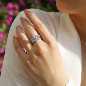 Close-up of S925 sterling silver triple-layered ring set with moissanite center stone
