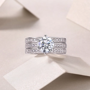 Close-up of S925 sterling silver triple row ring with round moissanite in six-prong setting