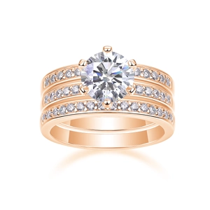 Macro shot of rose gold moissanite rings set with triple-layer six-prong setting