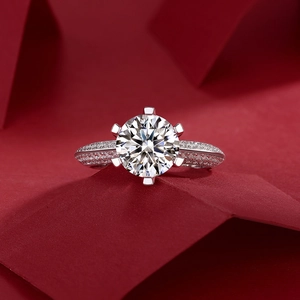 Close-up of a S925 silver six-prong engagement ring with lab diamond and side stones