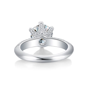 Macro shot of crown-shaped six-prong setting on S925 silver engagement ring with stones