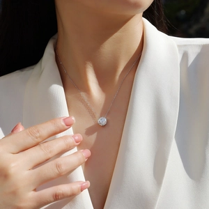 Minimalist S925 sterling silver necklace with a brilliant round six-claw moissanite pendant