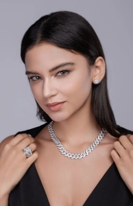 Close-up of S925 sterling silver iced out Cuban link chain set with moissanite stones