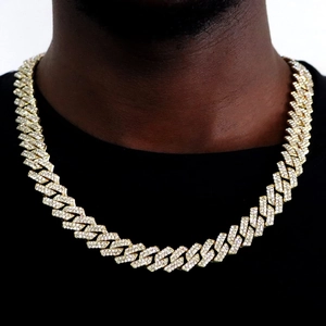 Close-up of golden S925 silver Cuban link chain with diamonds on model neck