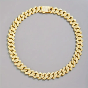 Close-up of hip hop Cuban link necklace in gold with micro-paved sparkling moissanite