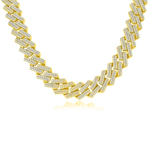 Macro detail of high-polish gold hip hop chain with pave-set shimmering stones