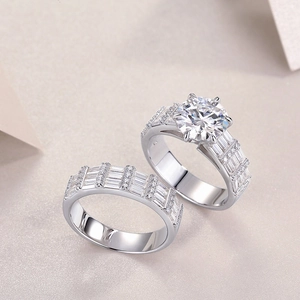 Detail of a 3-carat round moissanite ring with baguette accents in S925 sterling silver
