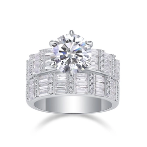 Detailed macro view of 3 carat round cut moissanite set in polished S925 silver rings
